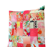 Vintage textile cushion 36 piece patchwork Bright pinks apricots and reds with bright red underside