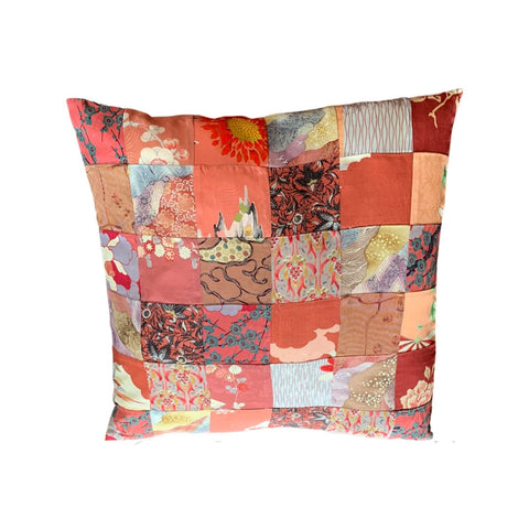 Vintage textile cushion 36 piece patchwork Bright pinks apricots and reds with bright red underside