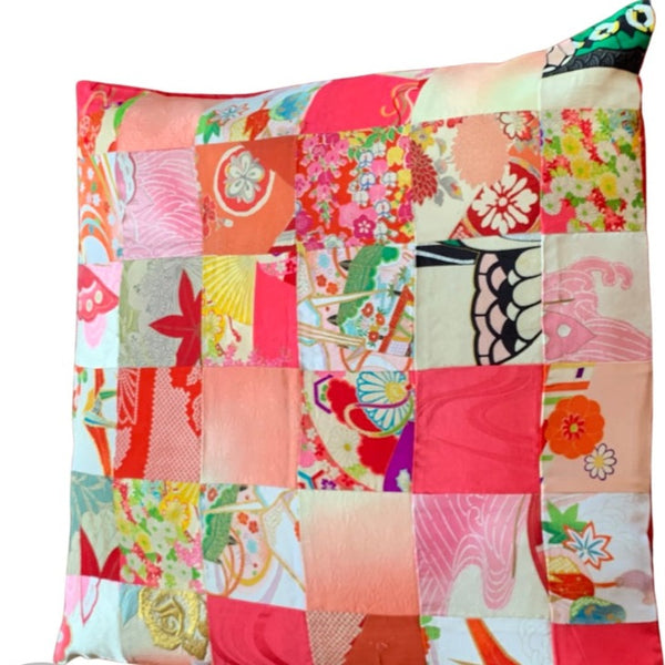 Vintage textile cushion 36 piece patchwork Bright pinks apricots and reds with bright red underside